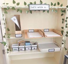 there is a shelf that has some books on it and other items in bins