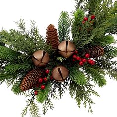 a bunch of pine cones and evergreen branches with bells