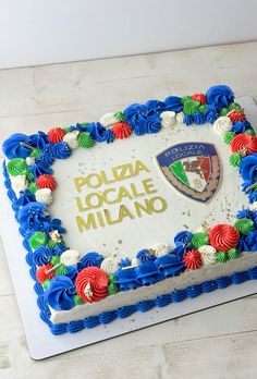 a cake that is decorated with flowers and the words poliza locale milano