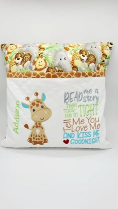 a giraffe pillow with the words read me a story and some animals on it