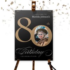 a black and gold 80th birthday card with an image of the queen on it