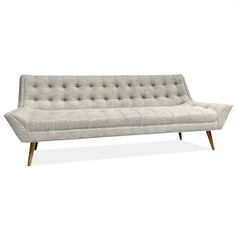 a white couch sitting on top of a wooden frame