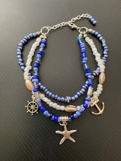 "🌴Tropical paradise! 🌴🌺 This beautiful handmade triple strand multi blue color glass seed bead ankle bracelet, with a tibetan anchor, starfish, and nautical wheel charms will give you that feel of the tropics! Makes a lovely gift for your special someone or keep as a \"Me Day\" beach accessory! The anchor symbolizes life, stability, and a connection. Starfish are well known for their amazing ability to regenerate limbs. The starfish enhances periods of healing and renewal.  It also represents Handmade Nautical Bracelets For Beach, Handmade Nautical Style Bracelets For Beach, Blue Bracelets With Lobster Clasp For Beach, Blue Beaded Ocean-inspired Anklet, Blue Nautical Jewelry For Beach, Ocean-inspired Blue Beaded Anklet, Nautical Style Blue Bracelets For Beach, Blue Anklets For Beach Festival, Blue Beachy Anklets For Gift