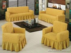 a living room with yellow couches and chairs