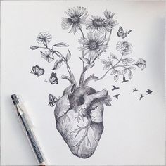 a drawing of a heart with flowers and butterflies flying around it on top of a sheet of paper