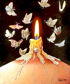 a candle with butterflies flying around it