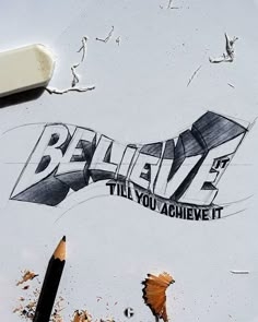 the words believe are drawn on paper with pencils