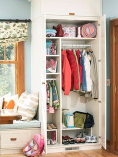 an image of a closet with clothes and outerwear for the season