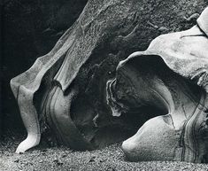 a black and white photo of a rock formation