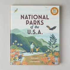 the book national parks of the usa is sitting on a table