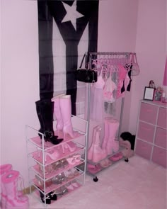 a pink and black girls'room with lots of shoes