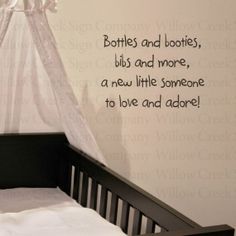 a baby crib in front of a wall with a quote on it that says bottles and bottles, bits and more, a new little someone to love and adore