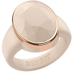 a rose gold ring with an oval stone in the center, on a white background