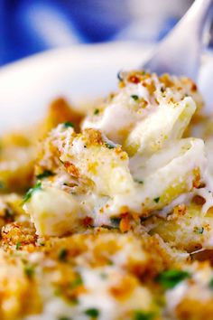 a close up of a plate of food with broccoli and cheese on it