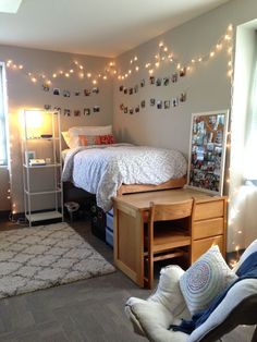 a bedroom with lights strung above the bed