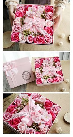 pink roses in a box with ribbon tied around the top and flowers on the bottom