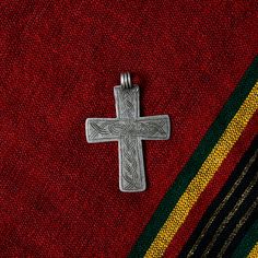 Antique handmade silver cross pendant from Ethiopia crafted by a local Amhara silversmith by melting and casting silver coins such as Maria Maria Thaler's, showcasing the intricate artistry and religious significance of Ethiopian Orthodox Coptic Christian culture.  This old silver cross measures 60 x 45 mm. What you see is what you get. Traditional Cross Pendant Large Jewelry, Traditional Pendant Jewelry For Commemoration, Spiritual Cross Pendant Jewelry For Commemoration, Traditional Handmade Cross Jewelry, Traditional Oxidized Cross Necklace, Traditional Cross Necklace With Oxidized Finish, Traditional Cross Necklaces With Oxidized Finish, Traditional Silver Cross Pendant Jewelry, Handmade Antique Silver Cross Necklace