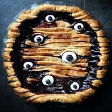 an apple pie with googly eyes on it