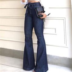 Elevate Your Denim Game With These Daring Dark Wash Bell Bottoms. These High Rise Denim Flare Jeans Offer A Stylish Twist On A Classic Silhouette, Featuring A Wide Leg Design That Exudes Retro Charm. The Tie Waist Bow Adds A Touch Of Elegance And Versatility, Allowing You To Create A Customized Fit That Accentuates Your Waistline Beautifully While The High Waisted Design Elongates Your Legs And Adds A Flattering Balance To Your Figure. The Carefully Crafted Dark Wash Denim To Effortlessly Comple Vestiti In Jeans, Wide Leg Pants Jeans, High Waist Wide Leg Jeans, Patch Jeans, Moda Jeans, Bell Bottom Pants, Dark Blue Jeans, Bell Bottom, Flared Jeans