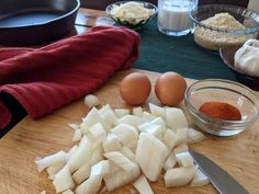 chopped onions and eggs on a cutting board