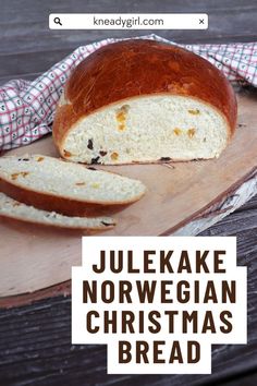 a loaf of bread sitting on top of a wooden cutting board with the words jukeke norwegian christmas bread