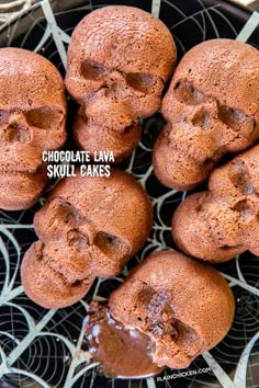 chocolate lava skull cakes on a plate with the words chocolate lava skulls in front of it