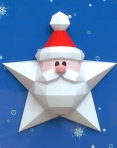 an origami christmas star with a santa claus hat on it's face