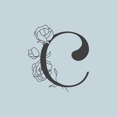 the letter c with roses on it is shown in black and white, against a light blue background