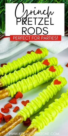 green pretzel rods with hearts on them and the title overlay reads, spring pretzel rods perfect for parties