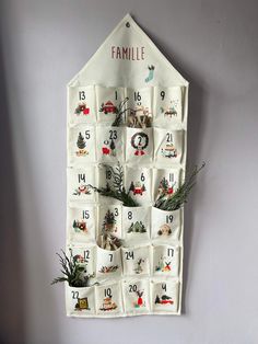 a family calendar hanging on the wall