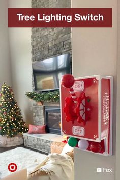 a red light switch sitting on the side of a wall next to a christmas tree