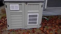 an outdoor storage unit in front of a house