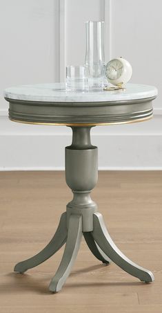 a round table with two glasses on it