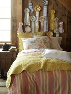 a bed with yellow and white bedspread in a room