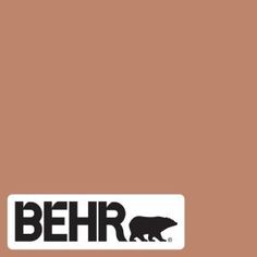 the logo for behr is shown in black and white on an orange brown background