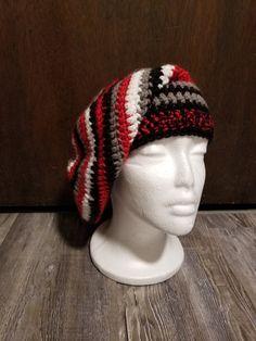 Crocheted super slouchy beanie in red, black, grey, and white worked from the top down in acrylic yarns. The width tapers from the top to the band, where the black and red yarns are doubled. Crutch Covers, Crochet Slouch Beanie, Crutch Pad, Slouch Beanie Hats, Slouch Beanie, Rainbow Crochet, Red Yarn, Slouchy Beanie, Top Down