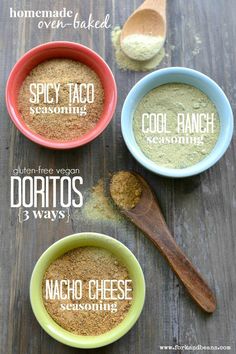 three bowls filled with different types of taco seasoning on top of a wooden table