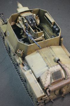 an old tank is on the ground with other items in it's back compartment