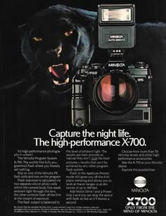 an advertisement for the nikon x700 camera featuring a black panther with its mouth open