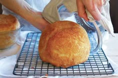 a person pouring batter on top of a loaf of bread