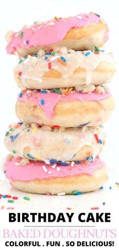 a stack of doughnuts with pink frosting and sprinkles