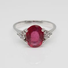 THE RUBY 1 PEC. – 2 . 18 CARATS. WITH DIAMONDS 6 PECS. – 0 . 18 CARAT. 18 K.- 750 WHITE GOLD RING 3 . 40 GRAMS. WIDTH 1 . 00 X LENGTH 1 . 90 CM. ANY SIZE IS AVAILABLE PLEASE CONTACT FOR MORE INFORMATION White Diamond Ring, Diamond White