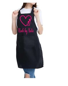 a woman wearing an apron with the words walk by faith on it and a pink heart