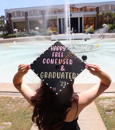 a woman wearing a graduation cap with the words happy free college and graduate written on it