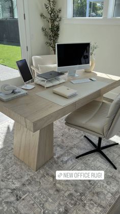 an office desk with a computer on it