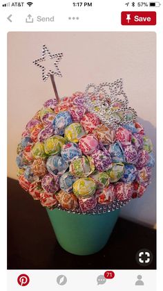 a cup filled with lots of candy sitting on top of a table