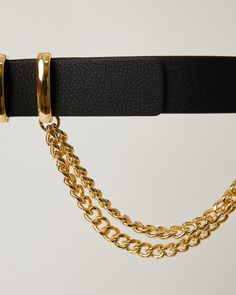 Add an effortlessly cool accent to your wardrobe with the Phoenix belt. Detailed with a shiny gold-tone buckle and double hanging chains, this edgy hip belt is a versatile statement piece. Details: Hip Belt Strap Width 1.5" (3.8cm) Buckle Height 2" (5.1cm) Genuine Leather with Suede Lining Double Hanging Chain Detail I Trendy Belts, B Low The Belt, Hip Belt, Hobo Style, Buckle Bracelet, Badass Women, Jumpsuit Shorts Rompers, Beauty Gift, Black Belt