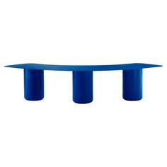 a blue table sitting on top of a white wall