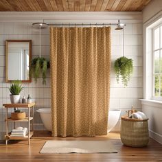 a bath room with a shower curtain and a rug on the floor next to a sink