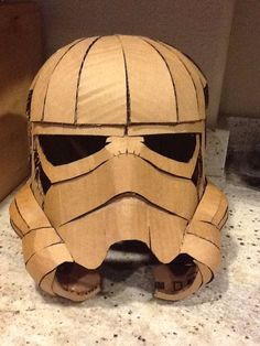 a cardboard star wars helmet sitting on top of a counter